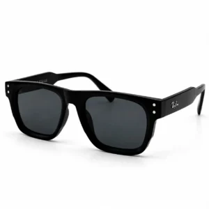 Angled view of matte black square-frame sunglasses with dark grey tinted lenses.