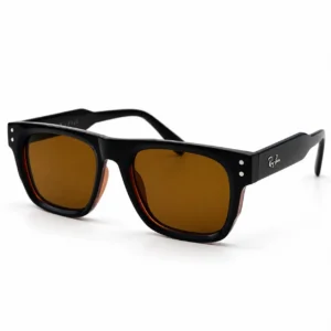 Angled view of black square-frame sunglasses with a tortoiseshell trim edge and brown tinted lenses.